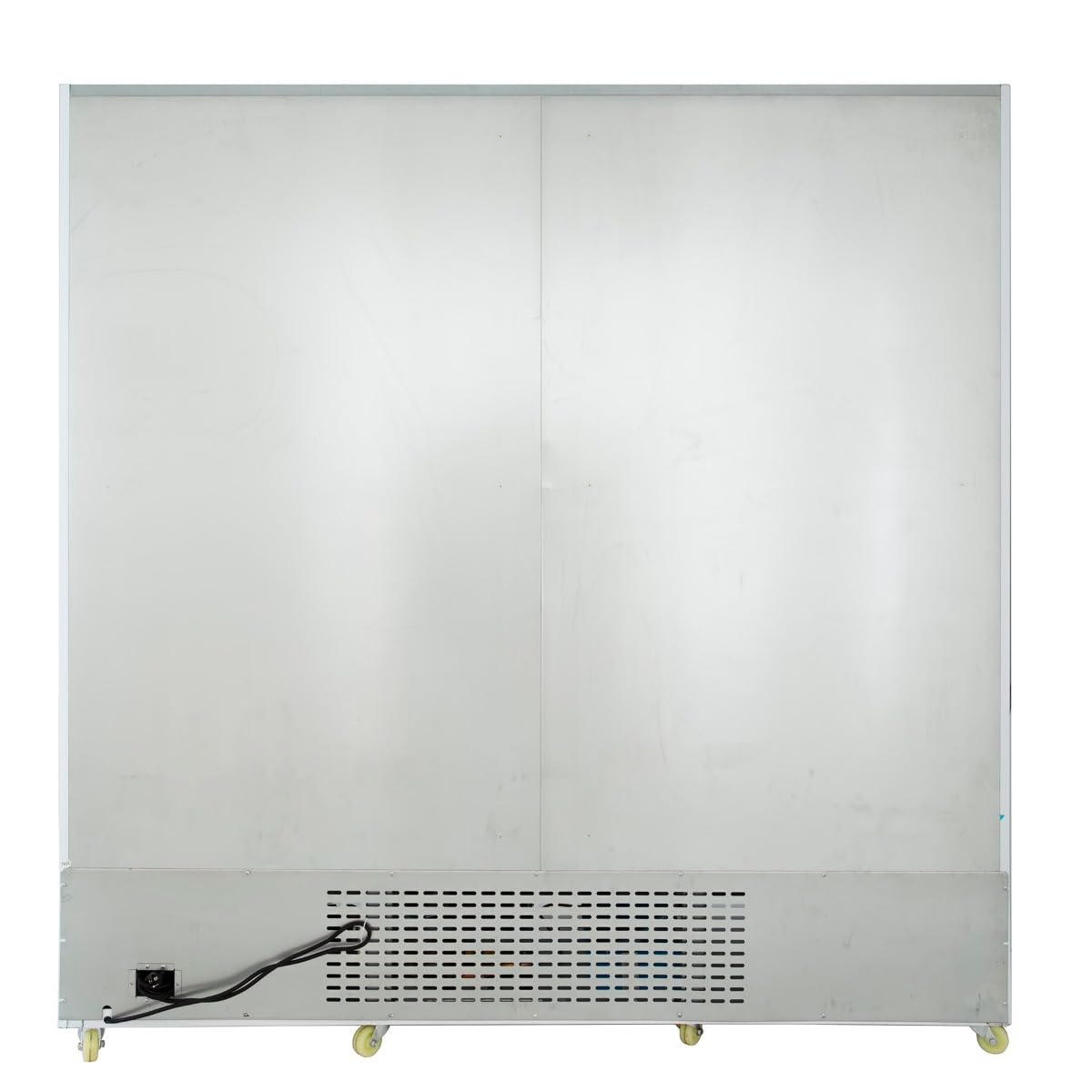 The image shows the back view of a large commercial refrigerator with a plain metallic surface. Vents and a power cord are visible at the bottom left, and four small caster wheels are attached to the base for mobility.
