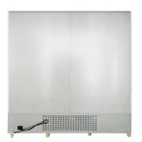 The image shows the back view of a large commercial refrigerator with a plain metallic surface. Vents and a power cord are visible at the bottom left, and four small caster wheels are attached to the base for mobility.