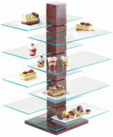 A modern Westport Pillar Riser dessert stand featuring a dark wood central column and six glass shelving tiers, each artfully displaying assorted desserts like layered cakes, parfaits in cups, chocolate-dipped treats, and fruit-topped pastries.