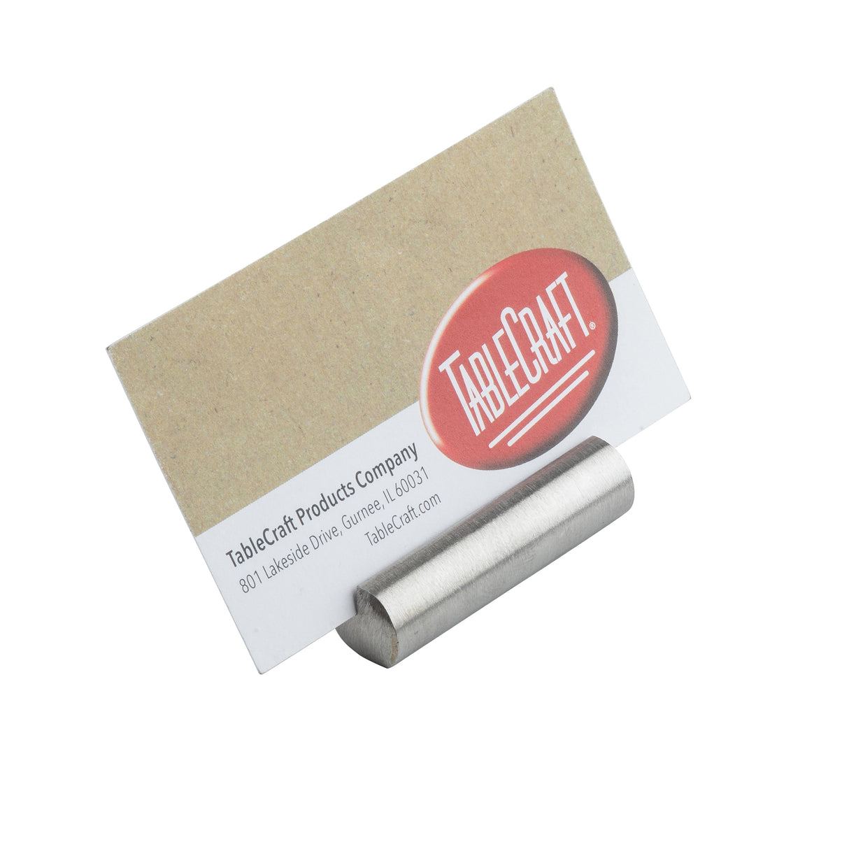 A business card reading TableCraft is displayed in a simple, cylindrical Bullet Card Holder crafted from stainless steel. The card features a kraft paper upper half and a white lower half with black text and a large red TableCraft logo on the right side.