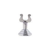 A shiny, stainless steel object with a rounded, tiered base and a forked, U-shaped top resembling two stylized bird heads facing outward—perfect as a card holder. The background is plain white.