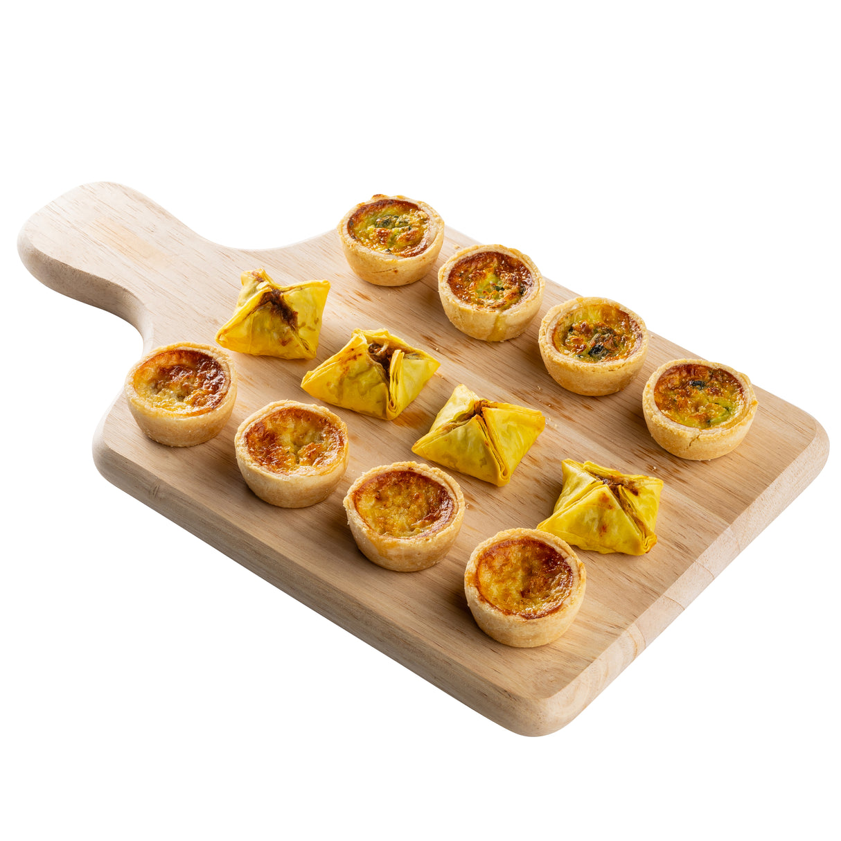 A natural finish wood bread board holds nine mini quiches with golden tops and four puff pastry parcels, all neatly arranged in rows. The TableCraft board’s light wood contrasts beautifully with the food against a white background.