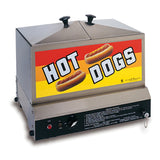 A commercial stainless steel hot dog steamer with two covered lids on top and a large colorful HOT DOGS sign on a yellow and orange striped background. Adjustable heat control knobs and instructions are visible below.