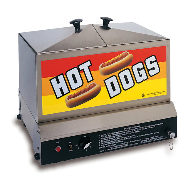 A commercial stainless steel hot dog steamer with two covered lids on top and a large colorful HOT DOGS sign on a yellow and orange striped background. Adjustable heat control knobs and instructions are visible below.