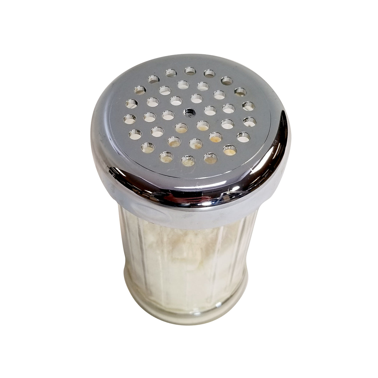 A clear glass shaker with a chrome plated TableCraft 800TCH Replacement Top featuring multiple round holes, filled with a white granular substance, likely salt or grated cheese, photographed against a white background.