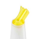 A close-up of a white PourMaster Complete Unit with a yellow, color-coded pour spout attachment. The double-tubed spout, made from BPA free material, angles upward for a modern and functional look against the plain white background.