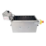 A rectangular stainless steel machine from Gold Medal Products with a metal control box on the left, dial and warning labels, slots inside the main compartment, 30 lb. oil capacity, and a yellow emergency stop button—an industrial electric fryer.