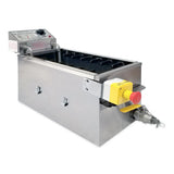 A stainless steel Gold Medal Products industrial electric fryer with a rectangular shape, black interior slots, control panel with knobs and dials on one end, and a yellow and red emergency stop button beside a metal valve. Features 30 lb. oil capacity.