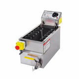 A commercial electric fryer with a 30 lb oil capacity features a hinged control panel, temperature dial, warning labels, yellow emergency stop button, and a drain valve with yellow handle. The rectangular tank is ideal for busy kitchen operations.