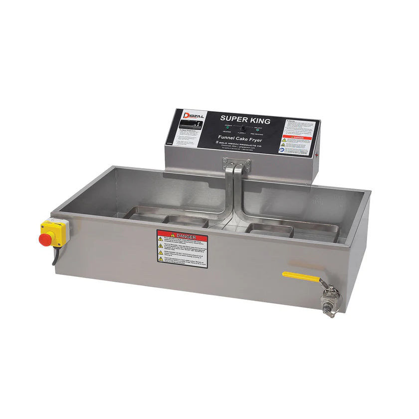 A stainless steel commercial fryer with an attached control box labeled Super King. It features a yellow emergency stop button on the left, warning labels on the front, and a metal spout with a yellow handle on the right for draining oil.