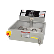 The Hot Shot Fryer is a rectangular metallic electric fryer with 50 lb oil capacity, a control panel, safety labels, red emergency stop button on the front left, yellow drain handle on the right, and dual heating elements inside the open fryer basin.