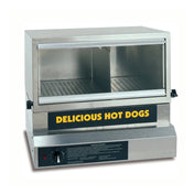 A stainless steel commercial hot dog display warmer with a glass front, sliding doors, and a yellow “DELICIOUS HOT DOGS” sign. The interior features perforated trays to hold and warm hot dogs, plus a built-in bun warmer for added convenience.