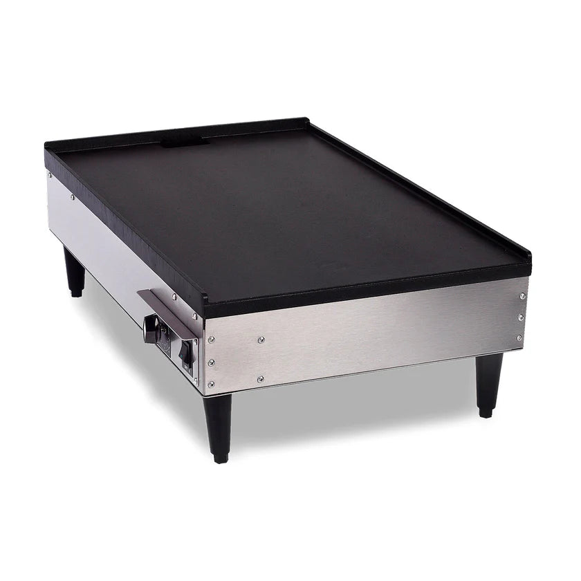 A commercial stainless steel Table Top Griddle with black legs, a flat non-stick coated cooking surface, and a heat control knob on the side. Elevated on four short legs, it runs at 1720 watts and features a slightly raised edge on the back.