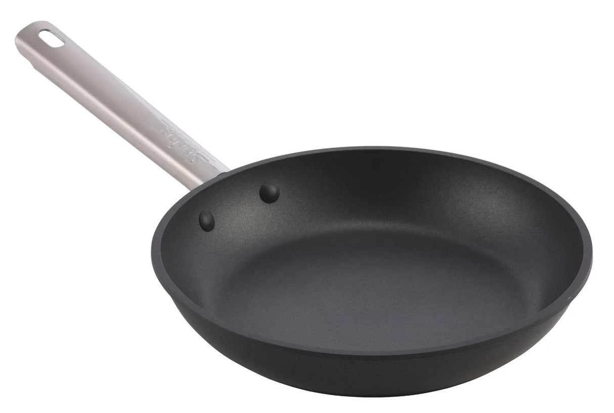 A non-stick fry pan with a black finish and silver metal handle is shown at an angle on a white background. The smooth interior and riveted handle highlight its quality, making it ideal for induction cooking. The pan appears clean and unused.
