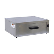 A stainless steel heated bun cabinet from Gold Medal Products with a rectangular shape, black plastic handle, and a small control panel on the right side. The drawer sits on four small feet, with a warning label on the left side panel. Plain white background.