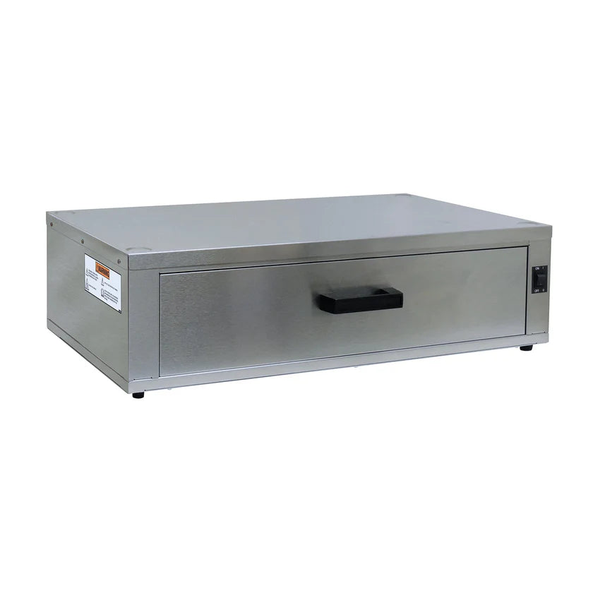 A stainless steel bun cabinet warming drawer by Gold Medal Products features a rectangular shape, black handle centered on the front, small black switch on the right, and a label on the left. It sits on four feet and has a sleek, industrial design.
