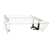 A modern, rectangular glass coffee table with angled edges and black metal supports. Its clear tabletop and sides, combined with visible black hardware, evoke a Food Shield aesthetic for a sleek, geometric look reminiscent of an NSF roller grill cover.
