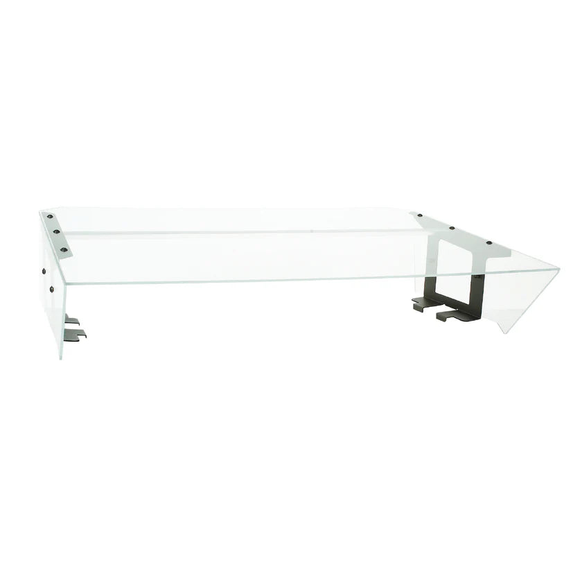 A modern glass coffee table with a clear rectangular top, angular glass sides, and black metal brackets. Inspired by Food Shield designs, its geometric form and transparent surfaces create a minimalist, contemporary appearance.