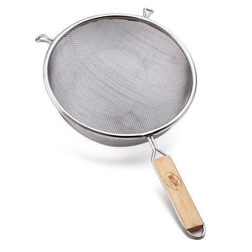 A round metal strainer with a medium mesh screen, two side hooks, and a long wooden handle featuring a printed logo. The angled design highlights the strainer's depth and sturdy construction.