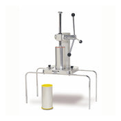 A manual Churro Extruder with a vertical stainless steel cylinder sits on a metal frame with four legs. Two black-handled levers are attached to the top. A cylindrical container with a yellow rim is placed in front for making 1" churros.