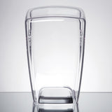 A clear, rectangular, plastic 64 oz. container with slightly curved sides and a black base stands upright on a reflective surface against a plain light gray background. The empty container has a smooth, minimalist design.