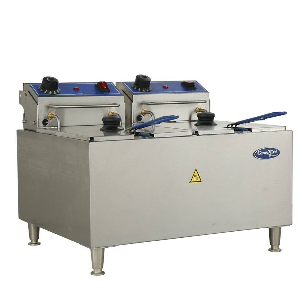A commercial electric countertop fryer with stainless steel construction, two blue-lidded fry baskets, temperature control knobs, indicator lights, four sturdy legs, a “CaterRik” logo, and a yellow caution symbol on the front.
