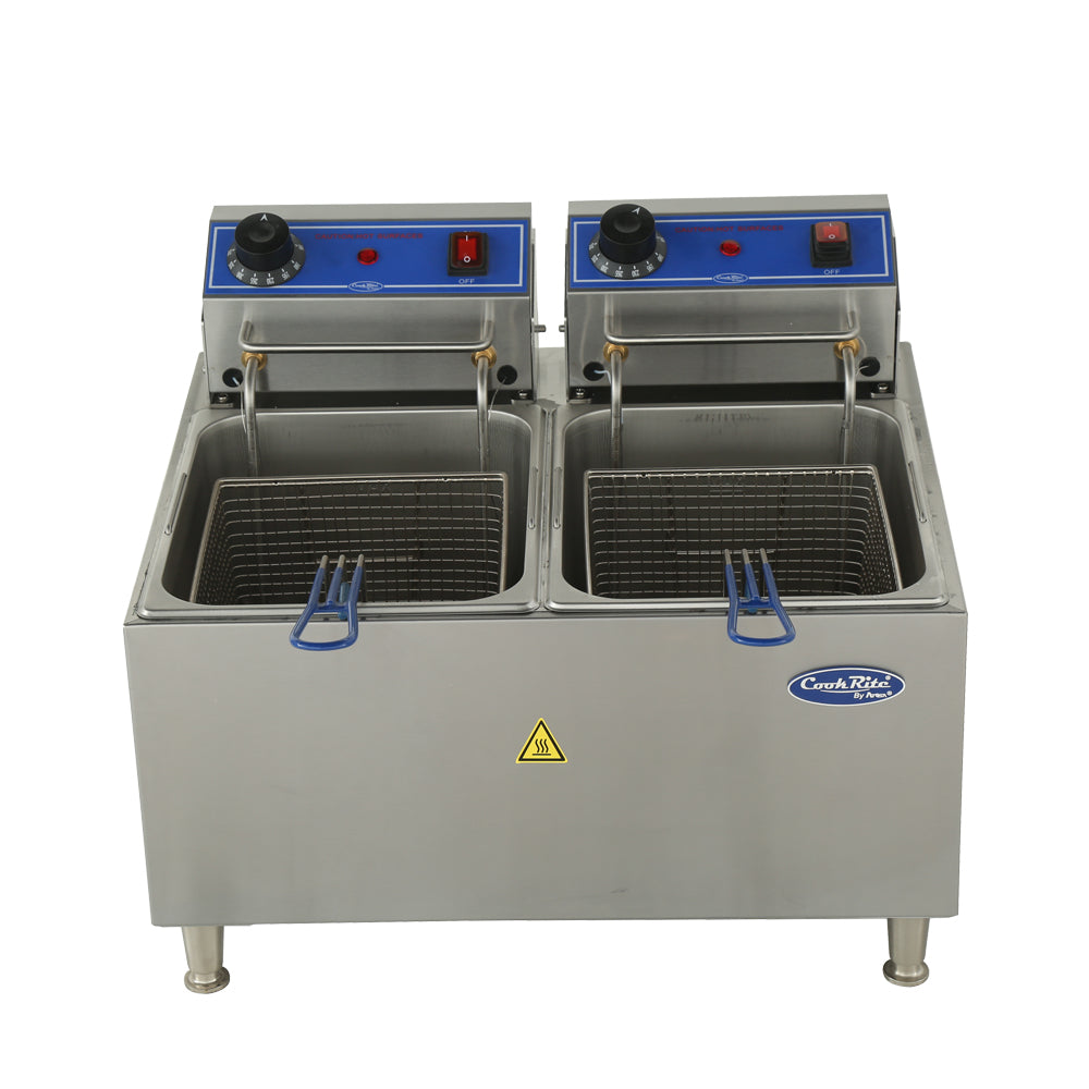 A stainless steel construction electric countertop fryer with 32 lb. fat capacity, featuring two frying baskets in separate oil tanks, blue control panels with knobs and switches, indicator lights, a caution sign on the front, and four metal legs.