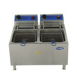 A stainless steel construction electric countertop fryer with 32 lb. fat capacity, featuring two frying baskets in separate oil tanks, blue control panels with knobs and switches, indicator lights, a caution sign on the front, and four metal legs.
