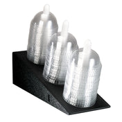 A black Dome Lid Organizer holds three stacks of clear, disposable plastic cups, each topped with a dome lid and a white straw. The polystyrene organizer arranges the cups in a neat, tiered formation for easy countertop access.