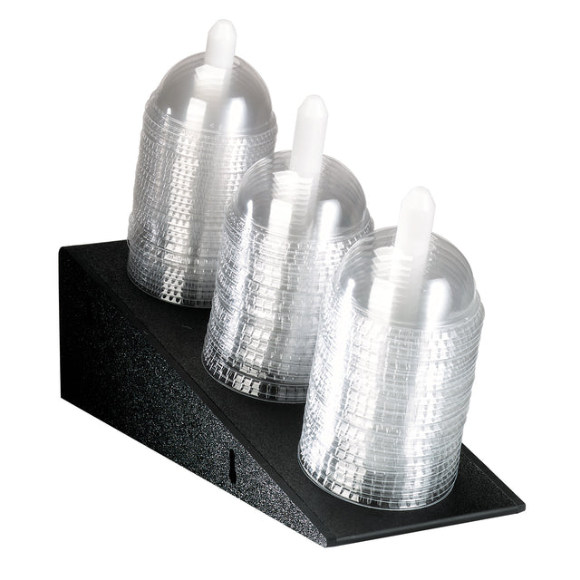 A black Dome Lid Organizer holds three stacks of clear, disposable plastic cups, each topped with a dome lid and a white straw. The polystyrene organizer arranges the cups in a neat, tiered formation for easy countertop access.