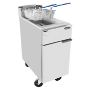A commercial deep fryer with a white exterior, natural gas operation, two wire fry baskets with blue handles on top, and a lower cabinet door; the 40 lb. capacity fryer stands on four black wheels against a plain white background.