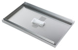 A rectangular stainless steel tray, similar to an ATFS-40 Fryer Tank Cover, lies flat with raised edges on two sides. A small, white, textured cleaning pad is secured near the center by translucent tape. The reflective surface appears clean and pristine.