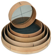 Four round sieves with smooth, light-colored wooden rims and fine 16 mesh wire screens are nested inside each other. The smallest sieve leans on top, showcasing the varying diameters and visible mesh lines of each piece.