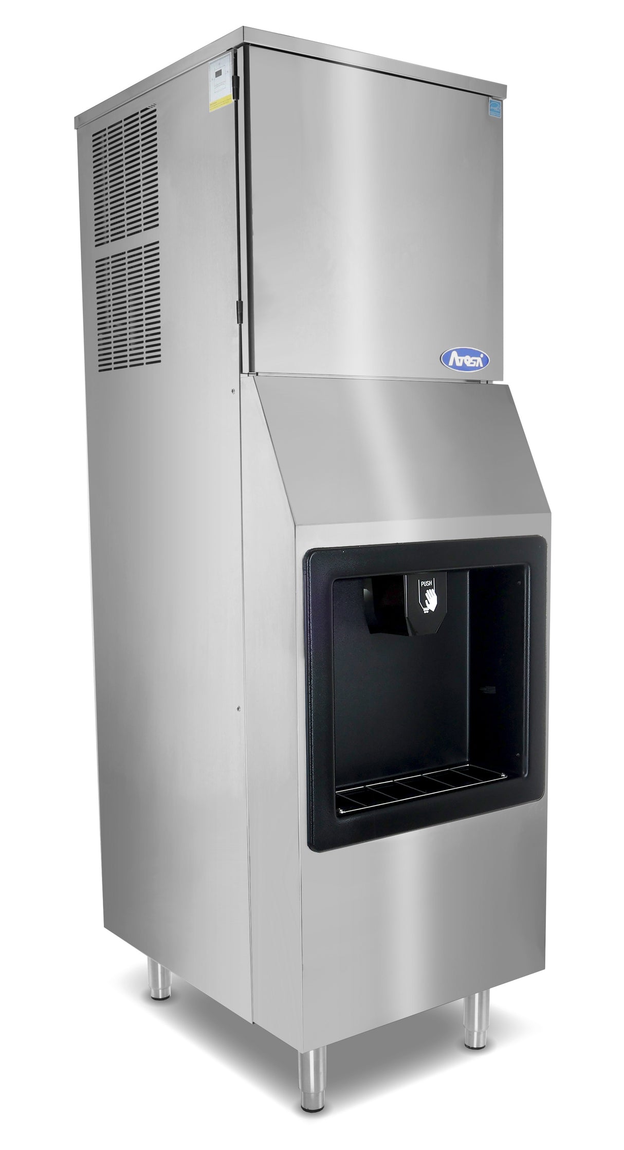 A stainless steel hotel ice machine with a boxy shape, standing on four short legs. It features a large black ice dispenser on the front for full cube ice and ventilation grilles on the side. A blue brand logo sits above the dispenser.
