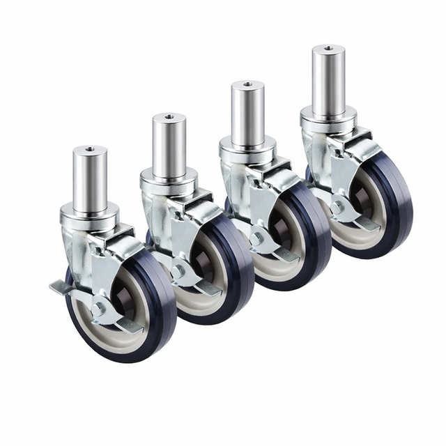 Four identical 5 inch casters with black rubber tires and silver metallic housings, each featuring a mounting stem at the top, are arranged in a row on a plain white background.