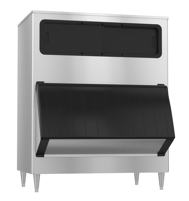 A large stainless steel ice storage bin with four metal legs, a black sliding door on top, and a black, angled front hatch for ice access. The smooth, modern surfaces make this ice bin ideal for restaurant or food service environments.