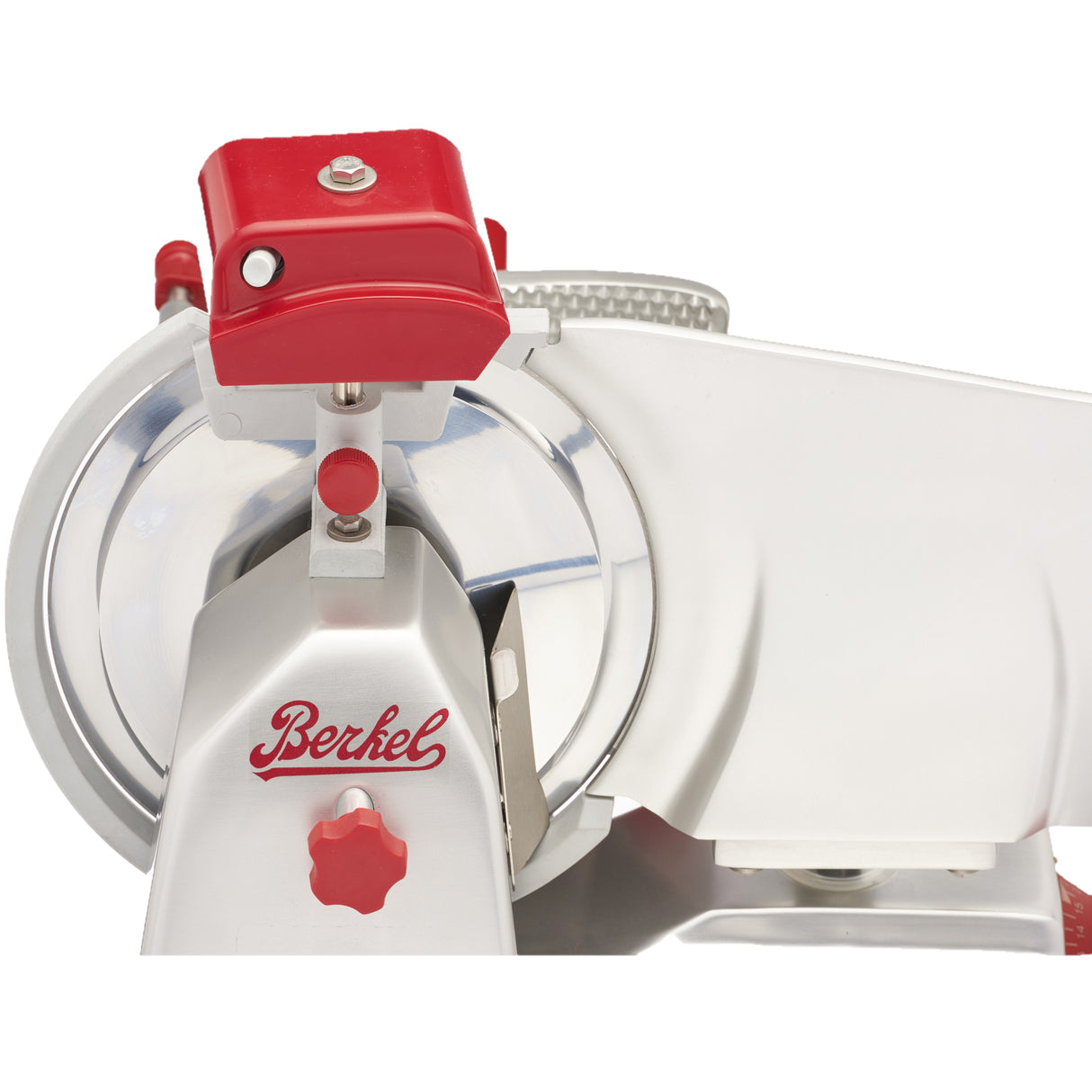 Close-up of a silver and red Berkel slicer featuring a 10 inch carbon steel knife. The image highlights the circular blade, adjustment knobs, Berkel branding in red, and metallic surfaces with red accents against a plain white background.