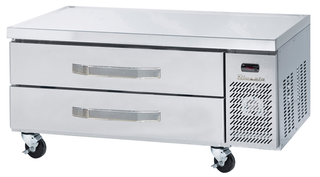 A stainless steel refrigerated chef base with two horizontal drawers, ventilation grates, and a digital display, mounted on four caster wheels for mobility. This sleek, reflective equipment stand is designed for versatile kitchen use.