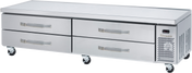A stainless steel refrigerated chef base with four horizontal drawers, mounted on caster wheels. The right end features a vented panel and control display. The flat top surface serves as an ideal equipment stand for food prep in a professional kitchen.
