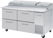 A large stainless steel refrigerated Pizza Prep Table with four drawers, two top compartments with lids, and ventilation grates. This two-section unit has wheels for easy mobility and the “True” brand name on the right side. The surface is clean and flat for food preparation.