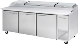 A large commercial refrigerated three-section Pizza Prep Table with stainless steel construction, three doors, a white countertop, and three lidded top compartments for ingredient storage. The unit is on wheels and features a vented cooling section on the right.