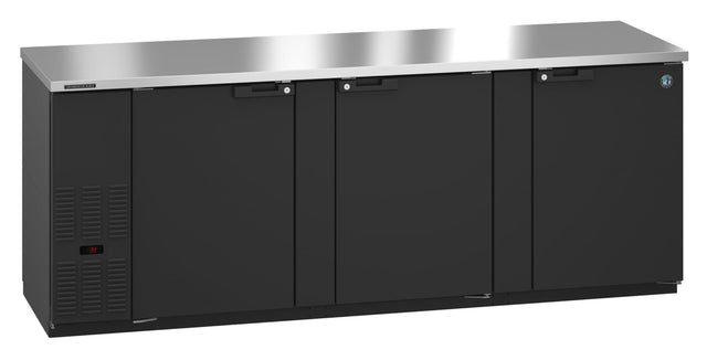 A sleek black Hoshizaki BB95 undercounter refrigerator with four doors, a reflective stainless steel countertop, and a digital display. This three-section cooler is perfect for professional kitchens or as a Refrigerated Back Bar Cooler in bars.