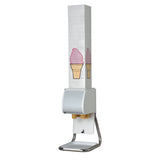 A white ice cream cone dispenser stand holds stacked paper sleeves with a pink ice cream cone illustration. The dispenser includes a metallic stand and a tray at the bottom for catching boxed cones.