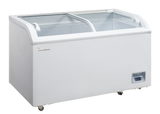 A large, white ice cream merchandiser chest freezer featuring two sliding glass doors on top, rounded edges, and handles. It has a vent near the bottom right and is mounted on four small wheels. The interior is empty and clean.