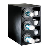A black plastic NSF cup dispenser holds three stacks of blue and white paper cups horizontally on the left, with compartments for lids, small containers, and stir sticks on the right. The unit is angled to show both the front and side.