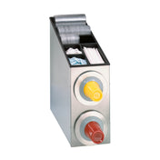 A metal cup dispensing cabinet holds plastic lids, straws, sugar packets, and stir sticks in top compartments. Two front-facing circular NSF cup dispenser slots hold stacked coffee cup lids—one yellow labeled HOT, one red labeled CAUTION HOT.