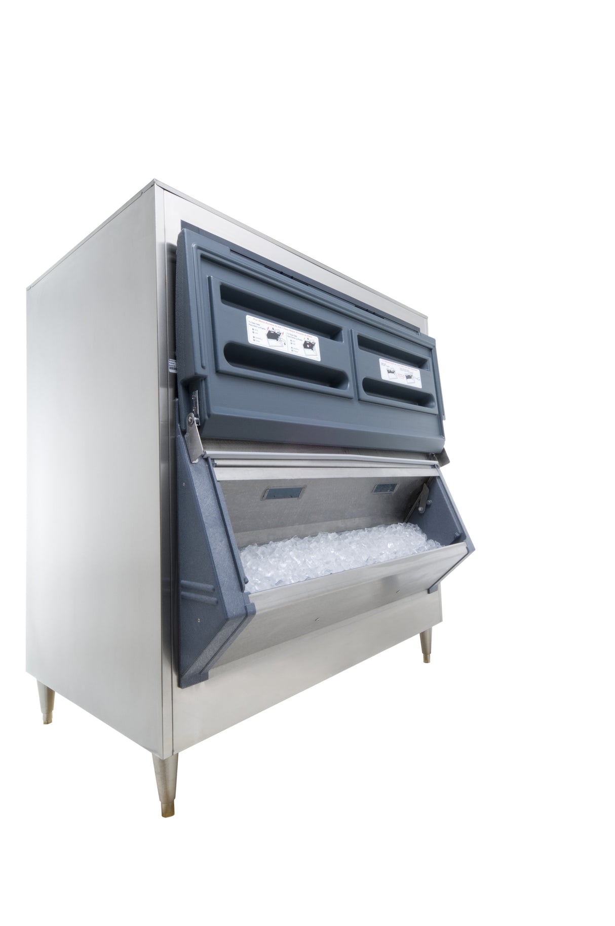 A commercial stainless steel ice machine with a front-facing open ice bin filled with ice. The top features two closed access panels with the Flexi-Top system. The machine stands on four metal legs, set against a completely white background.