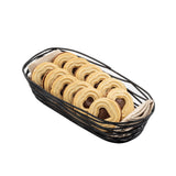 A TableCraft BK11709 black powder coated metal basket lined with beige cloth holds rows of round butter cookies with chocolate centers, neatly arranged and overlapping, on a white background.