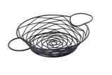 A black powder coated metal wire basket from the Artisan Collection features a circular, open-weave geometric pattern and two large rounded handles. The basket is empty, set against a plain white background.