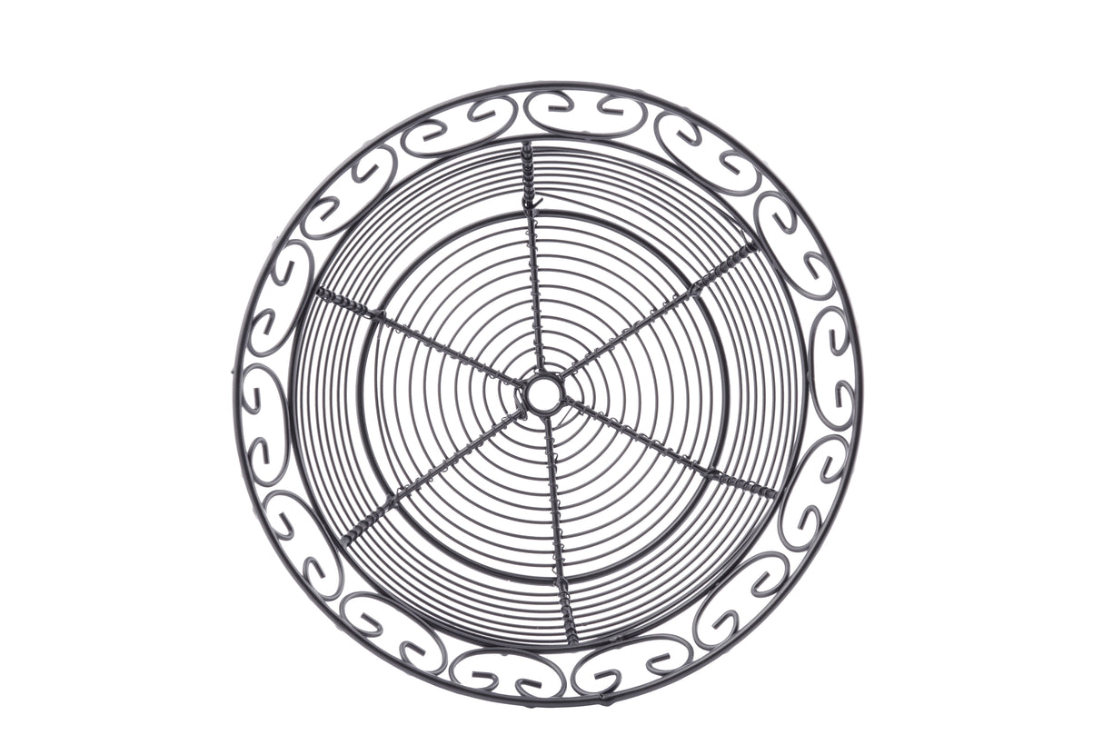 A round black powder coated metal basket from the TableCraft BK27508 Mediterranean Collection, this trivet features concentric circles and a swirl-patterned border. Its symmetrical, decorative design blends ornamental elegance with practical support.